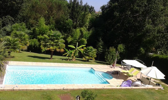 Bayonne House | Bayonne calm and relaxation by the heated swimming pool in lush greenery