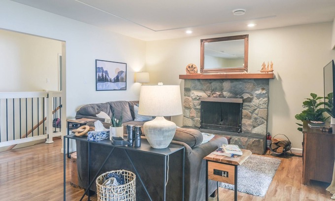 Courtenay House | Beachfront Cottage: Brick Fireplace + Ocean Deck