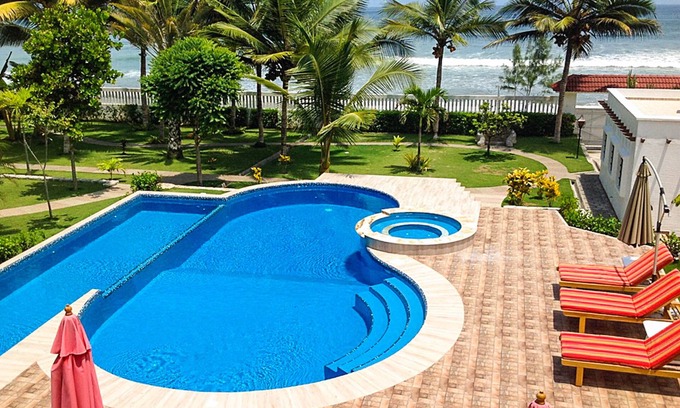 Comuna San Jose Cottage | Beachfront, large Pool, lap pool, & Jacuzzi, Barbecue area, Spectacular Gardens