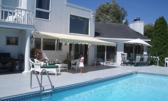 Westhampton House | Beautiful, dog-friendly 4BR home on 1.6 acres. Waterfront view and private dock.