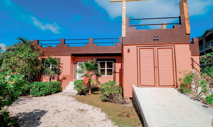 San Pedro Condo | Beautiful lake-view villa with balcony, pool, & partial AC - near dining & shops