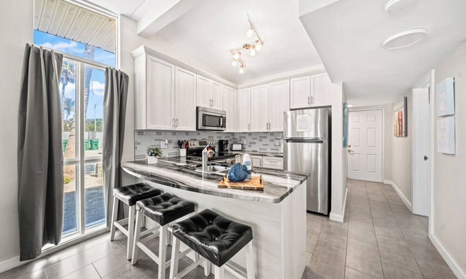 Orlando Beach Condo | Beautiful Riverfront Villa W/Private Beach Access, Fire Pit, & BBQ Grills
