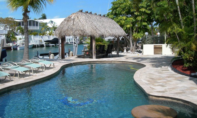 Venetian Shores Villa | Beautiful Venetian Shores, Cozy home, Heated pool, Tiki, Boat Lift, Fish & Dive.