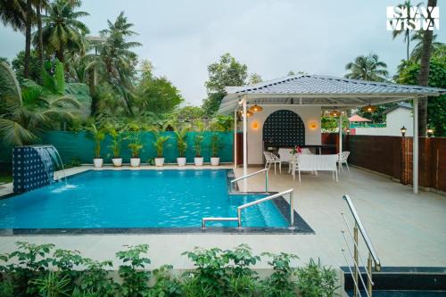 Varchi Ali Villa | Belas Palmeiras by VEO - Part of StayVista with Pool & Bonfire
