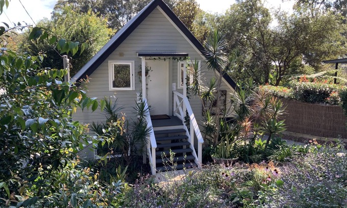 Pretty Beach Apartment | BIRDSONG Stylish private couples loft with water glimpses through the treetops.