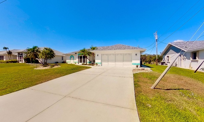 Pebble Beach House | Bohemian canal-front retreat with pool, beach gear, adult bikes, & AC - dogs ok