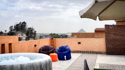 Giza Apartment | Boho Getaway with Pyramids View & Jacuzzi