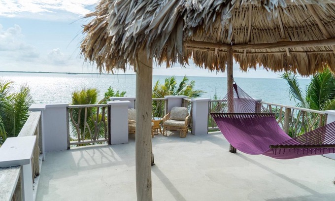 Thatch Caye Resort | Breezy Oceanfront Cabana w/Walk-In Shower & Private Rooftop Deck