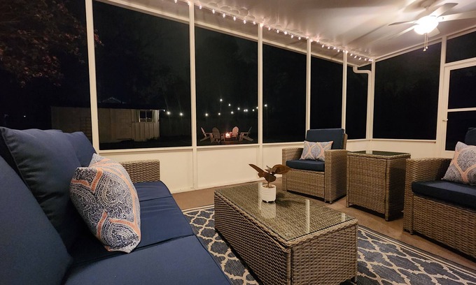 Longview House | Bright and airy Mid-Century Modern home with screened porch and firepit.