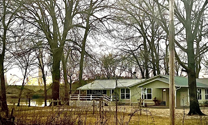 Wright House | Cabin sits in the back of a wild pecan grove over looking the Arkansas River
