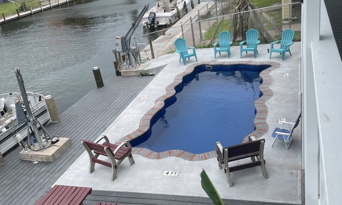City-by-the Sea House | Captains Quarter/canal front, private pool, dock for two boats.