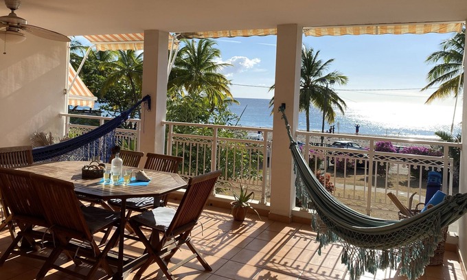 Le Carbet Apartment | Carbet Apartment on the beach side of standing with your feet in the water