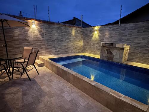 Mongagua House | Casa com piscina garagem para 4 carros