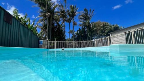 Caves Beach House | Caves Getaway - Pool, Air conditioned and close to the beach