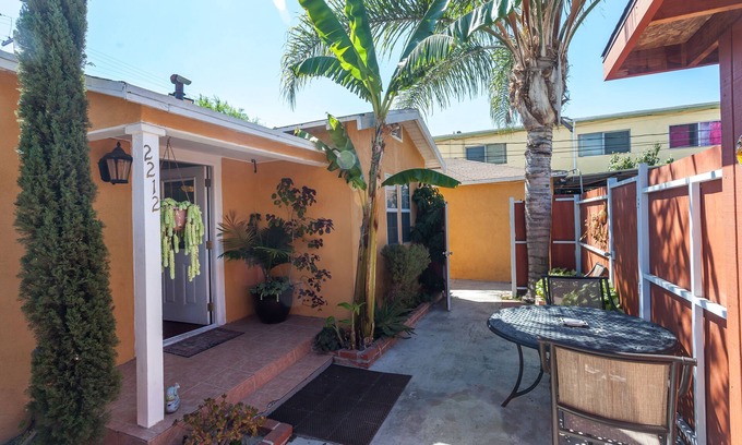 Mid City Cottage | Centrally located! 15 min. to beach, outdoor patio & pet friendly!