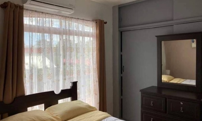 Grecia House | Charming 2-bedroom house with AC and WiFi in a quaint neighborhood.