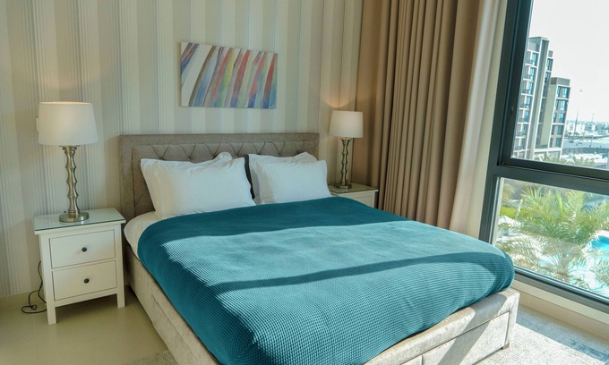 Muharraq Apartment | Charming 2BR apartment, beach access and pool view, ideal for extended stays.