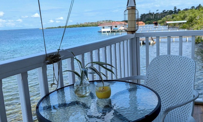 Big Bight Apartment | Charming bungalow over a coral reef in the Caribbean sea with stunning sunsets!