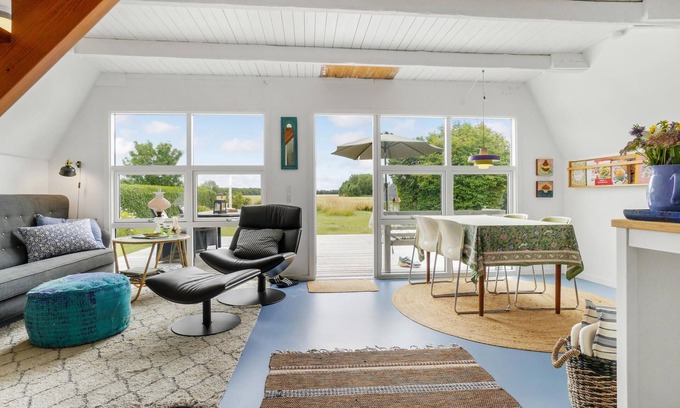 Tørresø House | Charming cottage with fireplace and beautiful view of fields.