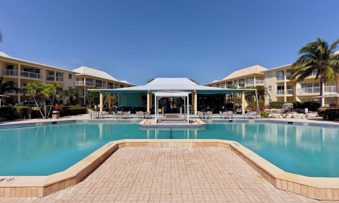 Crystal Harbour Apartment | Charming Suite w/Full Kitchen, Ocean Views & Pool, Ideal for Family Getaways