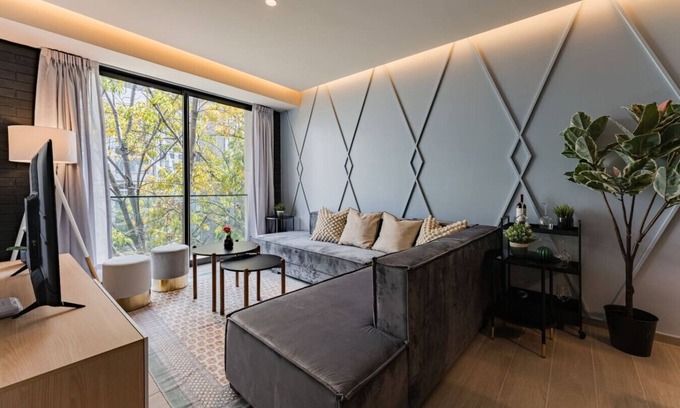 Del Valle Apartment | Chic Apartment with Tree-Lined Balcony Views & Parking