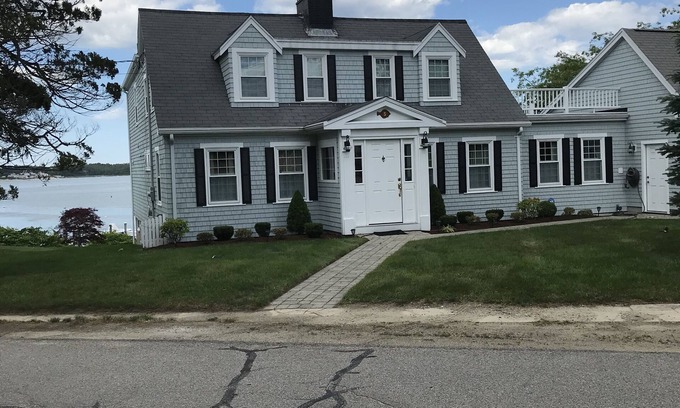 Buzzards Bay House | Classic cape on a hill over looking buttermilk bay