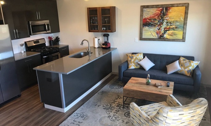 Steel Yards Apartment | Condo with deck facing the mountain, bike path and restaurant across the street, 5 min driving from down town