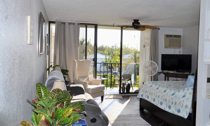 Royal Bahamian Estates Apartment | Coral Beach Retreat. Garden view. Steps from pool & beach. 1 mile to Port Lucaya