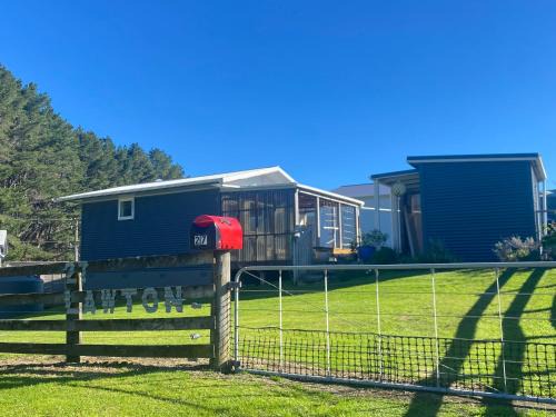 Kawhia House | Cosy Aotea Harbour Cottage - water views