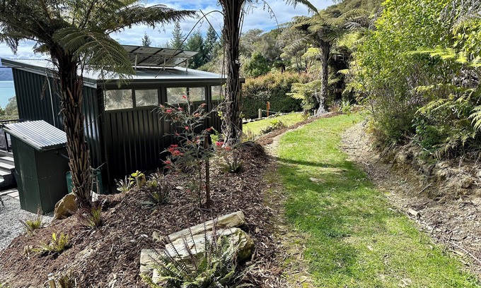 Moetapu Bay Cabin | Cosy modern two bedroom off-grid cabin, in the Marlborough Sounds
