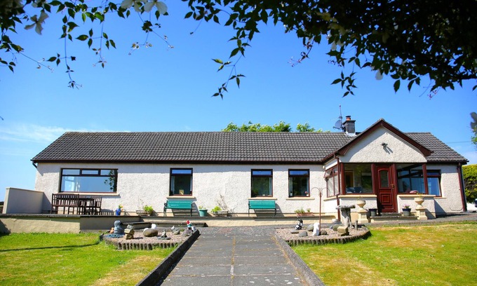 Carrickfergus House | Cosy, spacious, private hill top property, with stunning far reaching views.