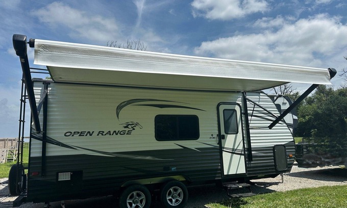 Dawson County House | Cozy camper with queen Murphy bed, bunks, and dinette conversion bed.