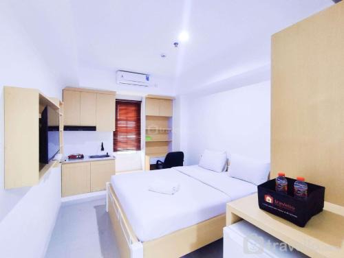 Jatingaleh Apartment | Cozy Studio at 9th Floor Paltrow City Apartment By Travelio