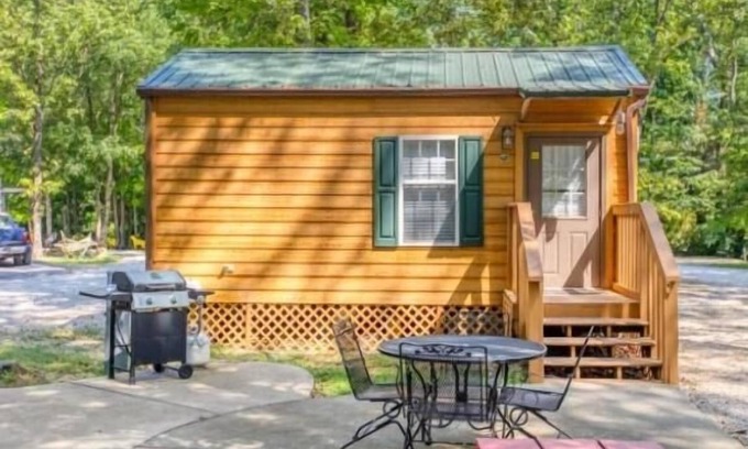 Manchester Cabin | Deluxe Cabin (w/Bathroom) - Deluxe Cabin (w/Bathroom) Better than a motel! Enjoy camping in comfort! Kitchen with stove top and full size fridge with dishes pots included. Full bathroom with shower. Cable TV DVD player. Gas grill on your own concre