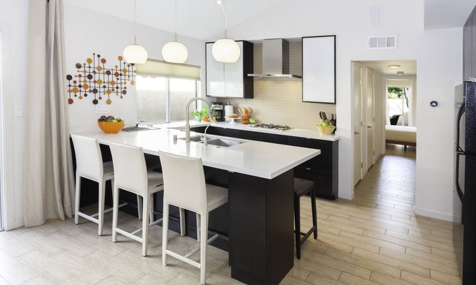 Uptown Design District Condo | Designer Condo With Wrap Around Patio Located in the Famous Movie Colony