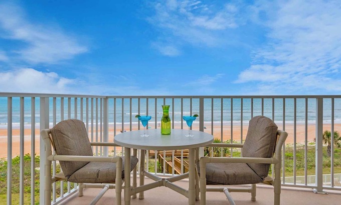 Seawinds Condo Condo | Direct oceanfront condo with a private balcony, heated beachfront pool, and garage