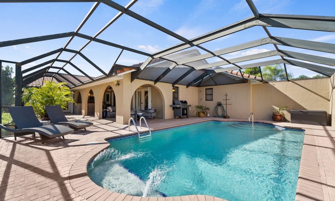 Burnt Store Isles House | Dog-Friendly Canal-Front Home with Heated Pool, Dock, Screened Lanai & Free WiFi