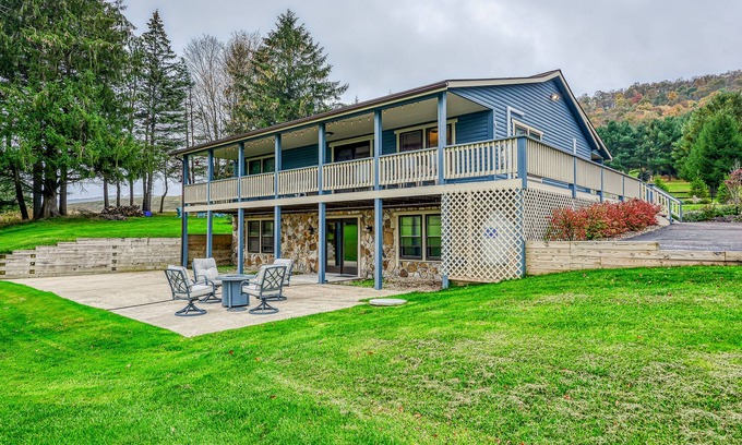 McHenry Cabin | Dog-friendly home with private pond, wraparound porch & fireplaces