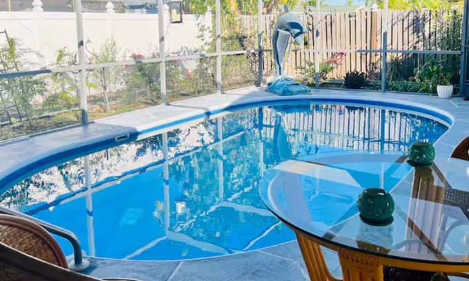 Regency Park House | Dog-Friendly Tropical Getaway with a Covered Pool -Nearby Beaches!