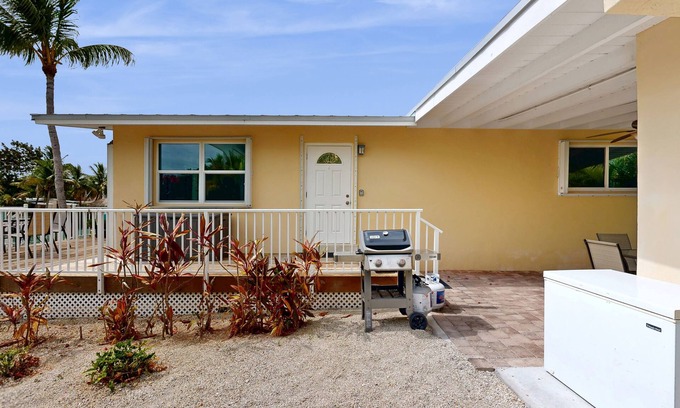 Key Colony Beach House | Dog-friendly waterfront home with dock, pool, gas grill, & beach access
