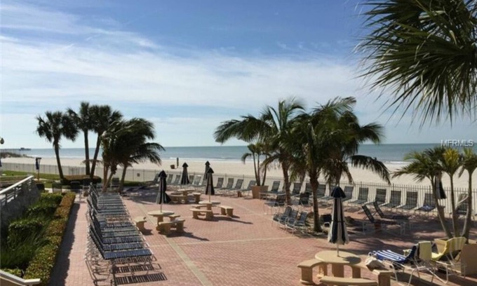 Redington Shores Condo | Enjoy Beachfront Living, relax in the heated pool, in gated community