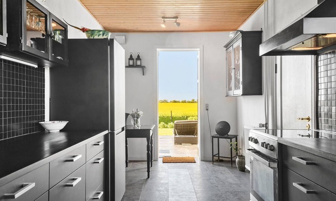 Korsor House | Enjoy the tranquillity of nature in this vacation home, nestled in an idyllic landscape.