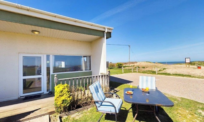 Bacton Cottage | Fantastic chalet located alongside the beach.