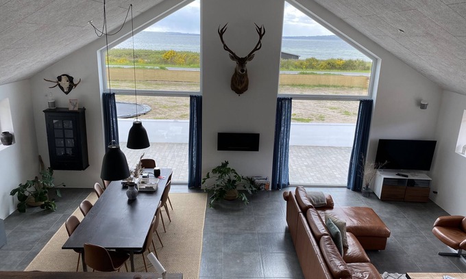 Vibæk Strand Villa | Fantastic home in Ebeltoft with 180 degree sea view and unique living space.