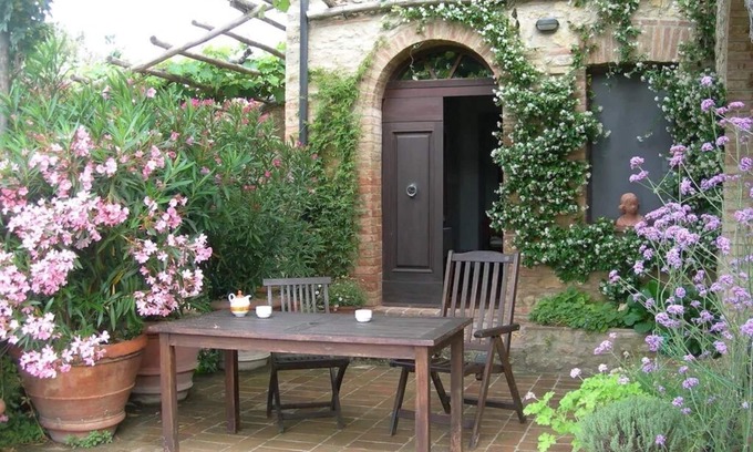 Castelnuovo di Val di Cecina Apartment | Farmhouse from 17th century with antique furniture and many flowers.