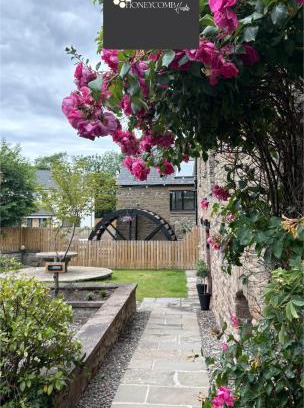 Douglas and Angus Apartment | FLOUR MILL HOUSE at PITKERRO MILL, 4 double bedrooms, TVs, 3 en-suite, separate shower, wc, fully equipped kitchen, games room, large family lounge, private parking, WiFi, private garden and courtyard, long stay rates available through Honeycomb Hosts