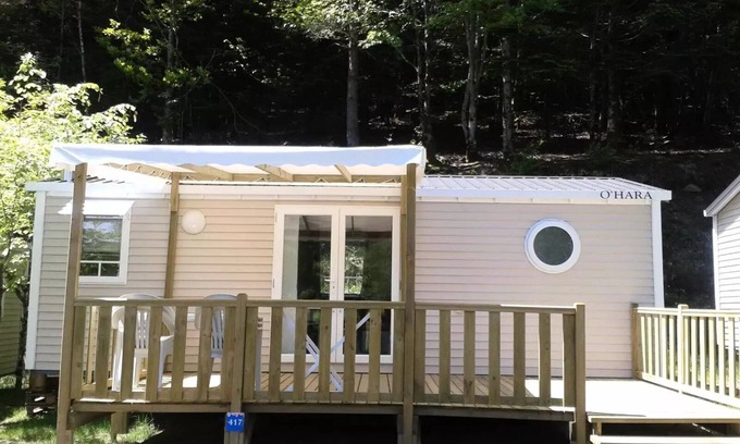 Treignac House | Flower Camping La Plage * - Mobile home Comfort 29m2 (2 bedrooms) + TV + semi-covered terrace 18m2 6 people