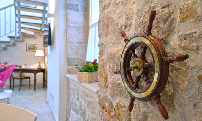 Betina House | Frantoio House. Charming stone house in front of the dock