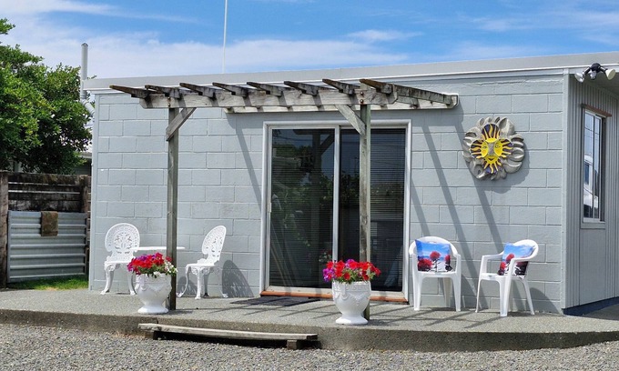 Napier House | Fully self contained unit with separate bedroom on beachfront property,