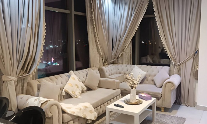 Al Hoora Apartment | Golden Oasis, a luxurious apartment with stunning partial sea & city views.